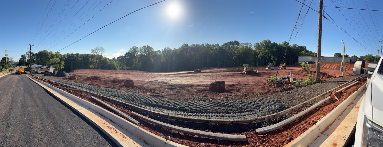 New curb and gutter with an erosion control blanket installed along the grade