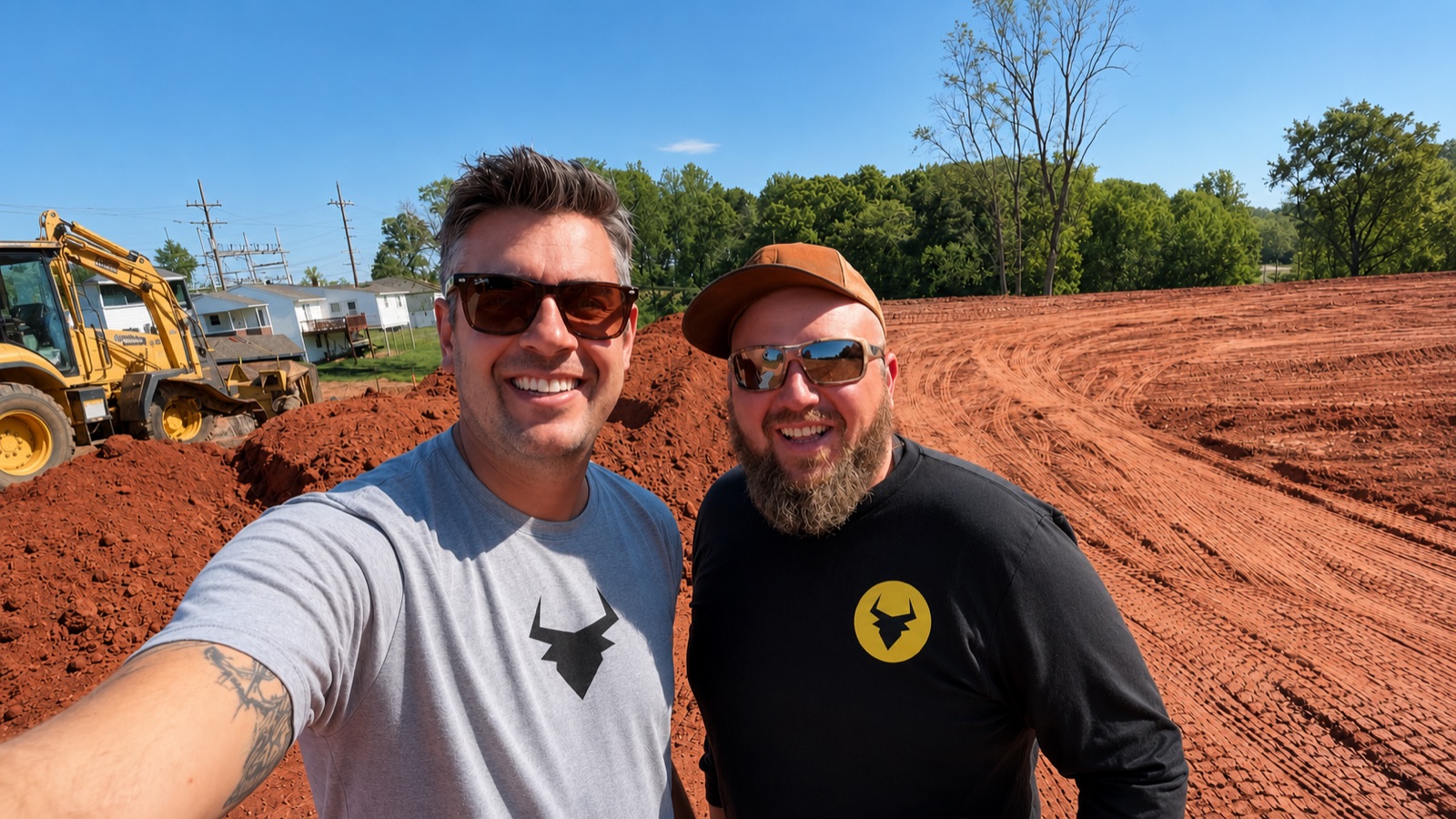 Oxen Civil founder Tim Dantas and crew member Roscoe on an active red-clay jobsite