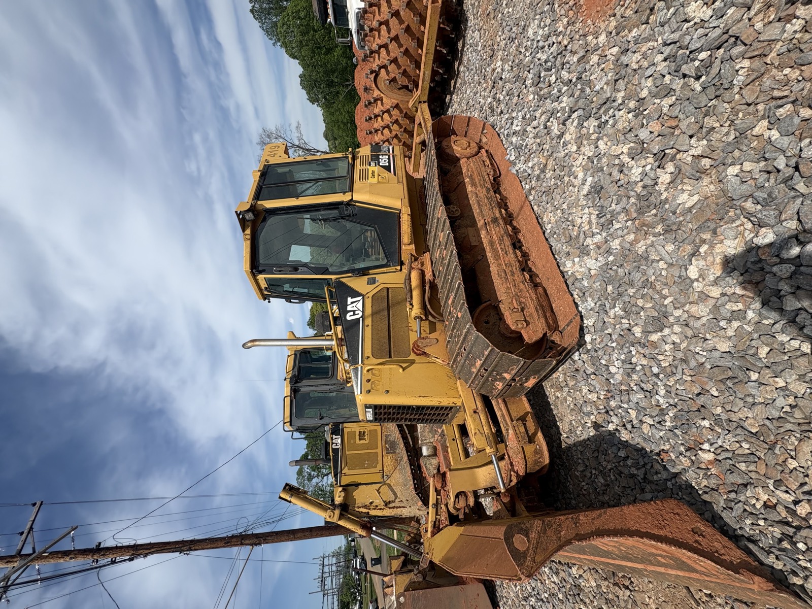 Oxen Civil dozer grading a base course ahead of paving