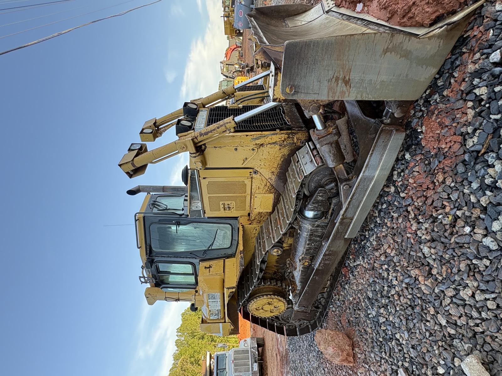 Oxen Civil loader clearing a graded site ahead of a demolition project